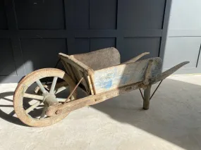 Washed out blue French wooden wheelbarrow